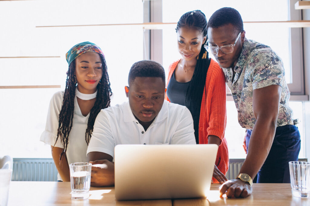 People collaborating on a laptop